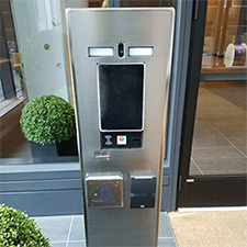 Pedestal PRO customized stainless steel cabinet, Model MX-SS-7F, with ButterflyMX® 7 in. touch screen video intercom, handicap push button actuator, and HID® card reader
